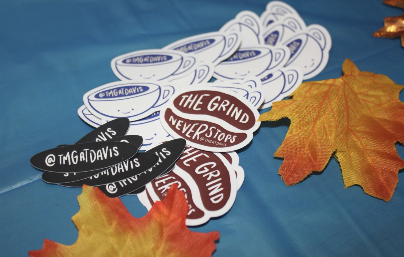 Branded stickers styled on a table, product photography